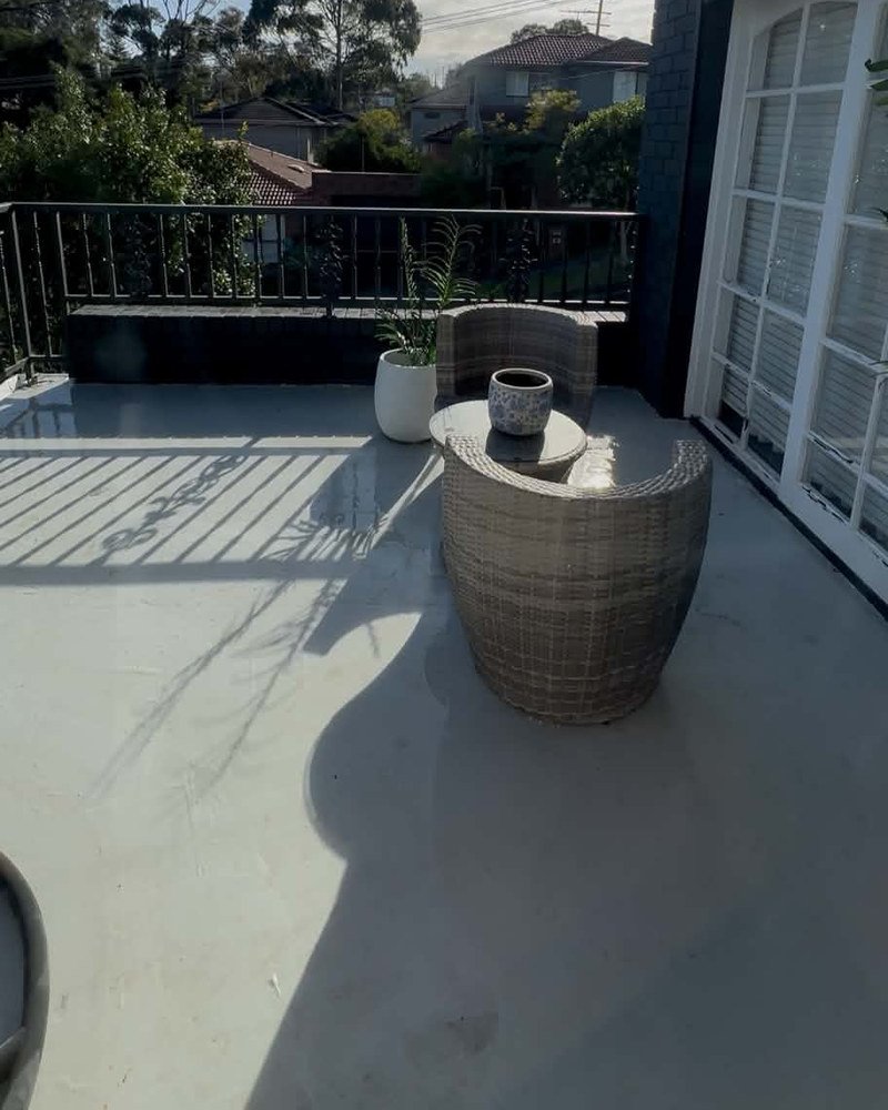 Balcony surface, outdoor seating and railing following cleaning