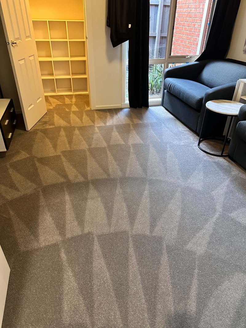 Completed carpet cleaning in a furnished room