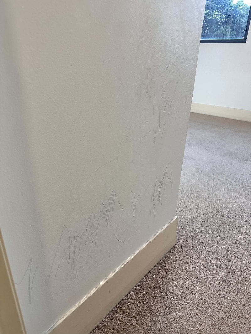 Visible marks on an interior wall before cleaning